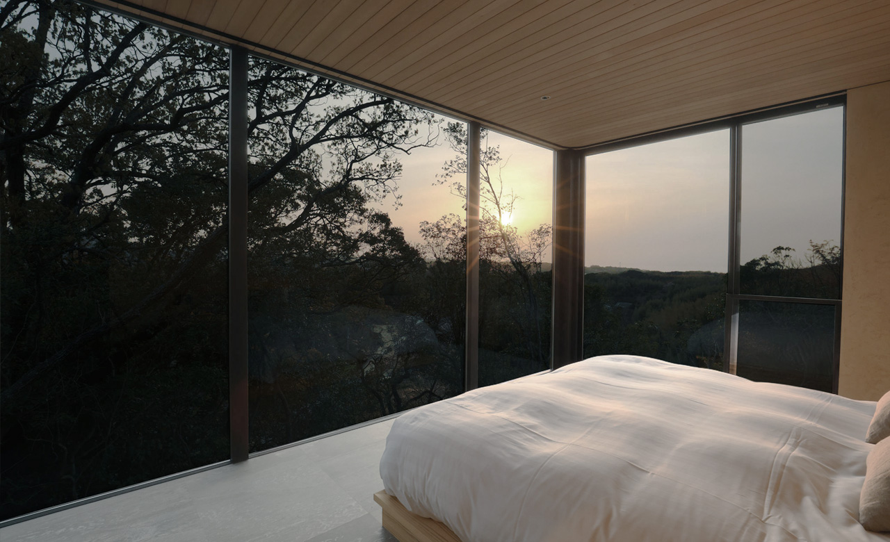 ベッドルームとそこから見える緑の多い景色